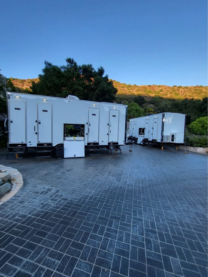 Luxury restroom trailers staged for an event